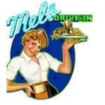 Smiling waitress in retro uniform holding a food tray.