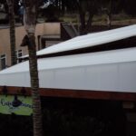 Retractable awnings over outdoor patio with Cafe Cabana sign.