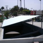 Hinged roof panel open, staircase leading inside.