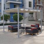 Modern outdoor patio with pergola, cushioned seating, and barbecue grills.