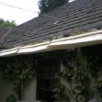 Partially extended retractable awning above patio.