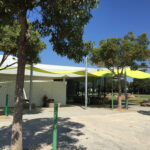 Library building with shade sails outside.
