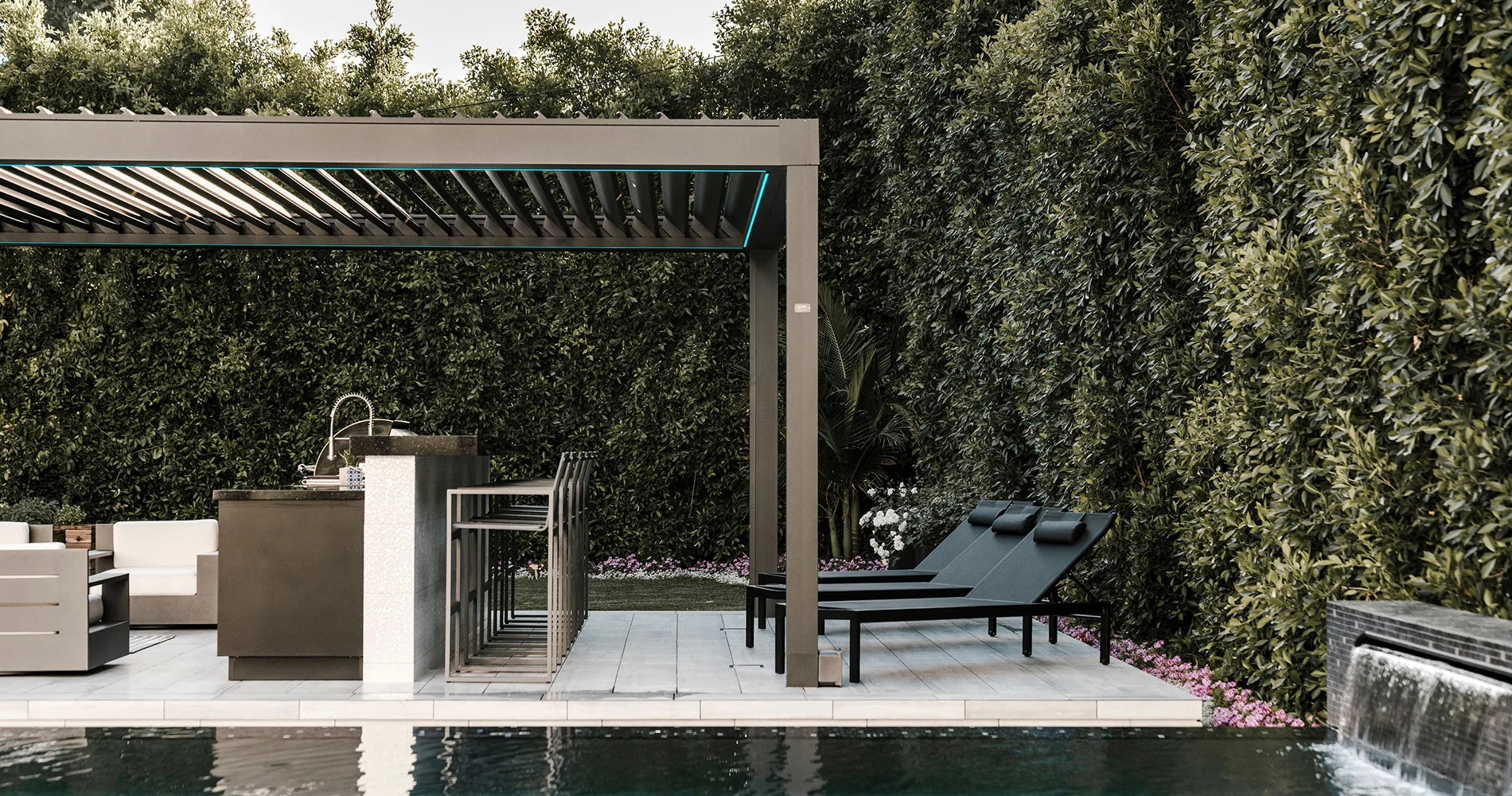 Outdoor patio with covered kitchen, bar seating, lounge chairs, and pool.